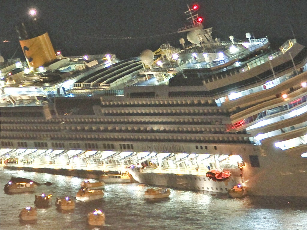 Some of the 4,200 passengers flee in lifeboats after the Costa Concordia ran aground off Isola del Giglio in Italy, gashing open its hull