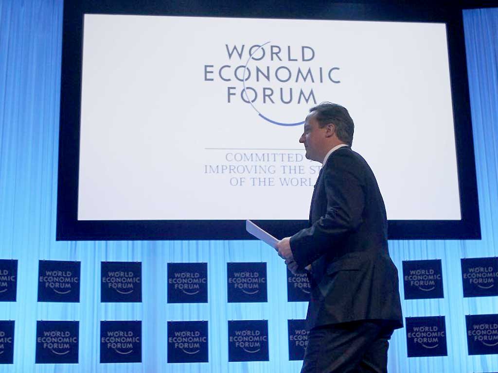 David Cameron arrives on stage at the World Economic Forum in Davos