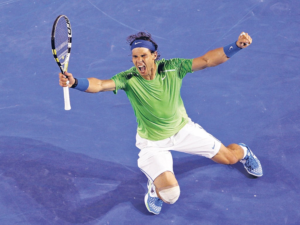 Rafael Nadal celebrates his win over Roger Federer
