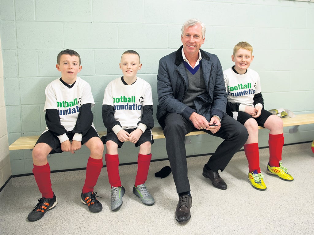 The Newcastle United manager, Alan Pardew, with some of the Redheugh boys at the Gateshead club’s new premises