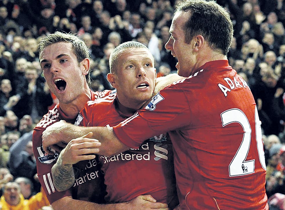 Jordan Henderson (left) and Charlie Adam get to grips with Craig Bellamy after he scored the winner in the League Cup semi-final against City