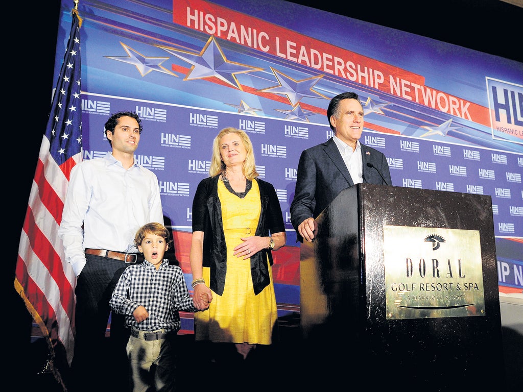 Mitt Romney is joined by his wife Ann, son Craig and grandson Parker in Miami, Florida