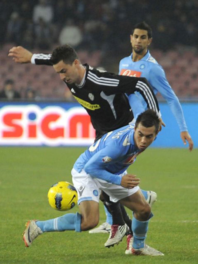 Napoli forward Eduardo Vargas of Chile, foreground, vies for the ball
