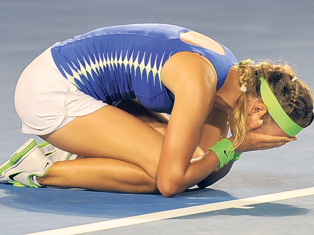 Looking down on the rest: Victoria Azarenka savours the moment after beating Maria Sharapova in their Australian Open women's singles final in Melbourne