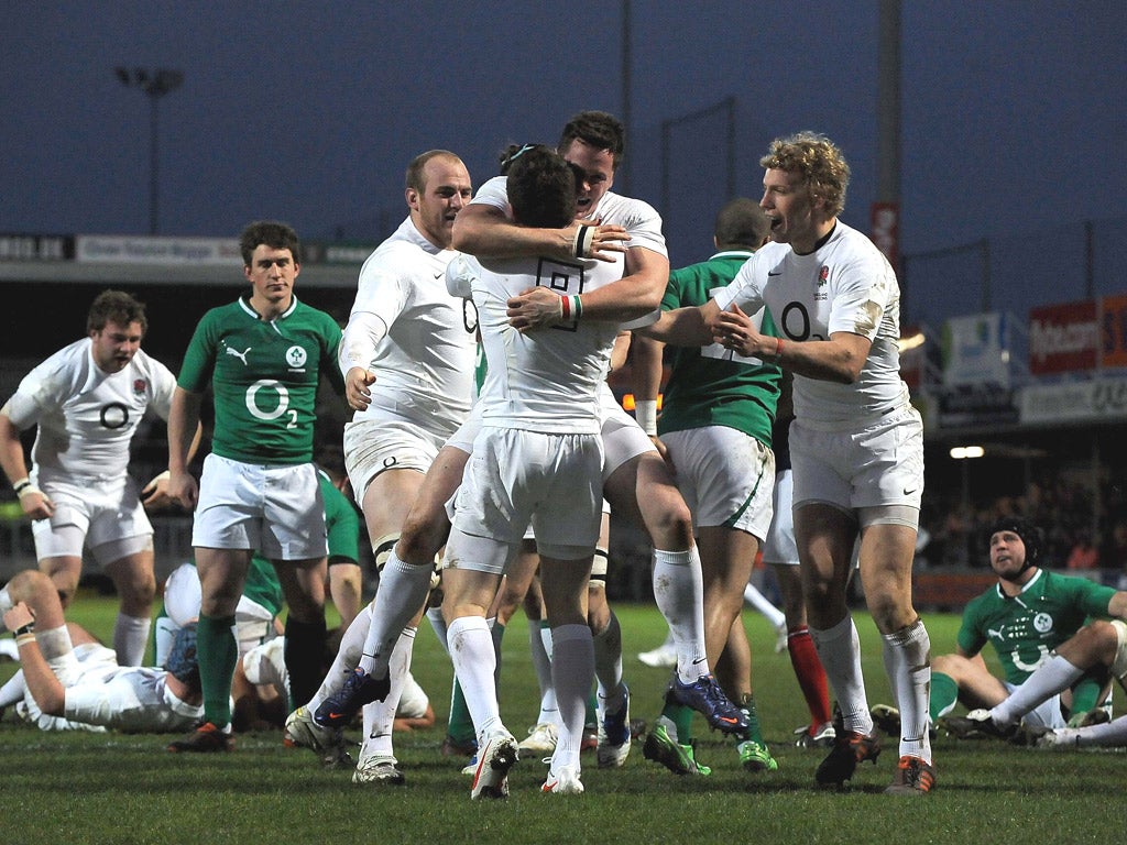 Andy Saull and Billy Twelvetress congratulate Ben Spencer on his try for England Saxons against the Irish Wolfhounds