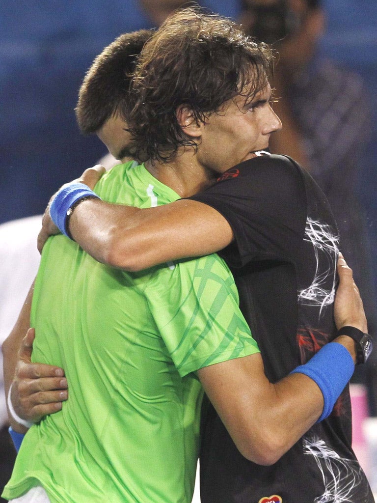 Novak Djokovic and Rafa Nadal hug after their final match at the Australian Open