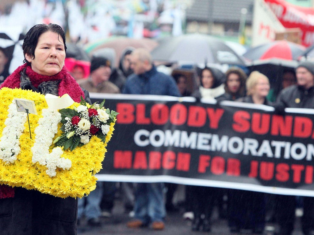 Linda Nash, whose brother, William, was killed on Bloody Sunday, leads yesterday’s commemorative parade through the city