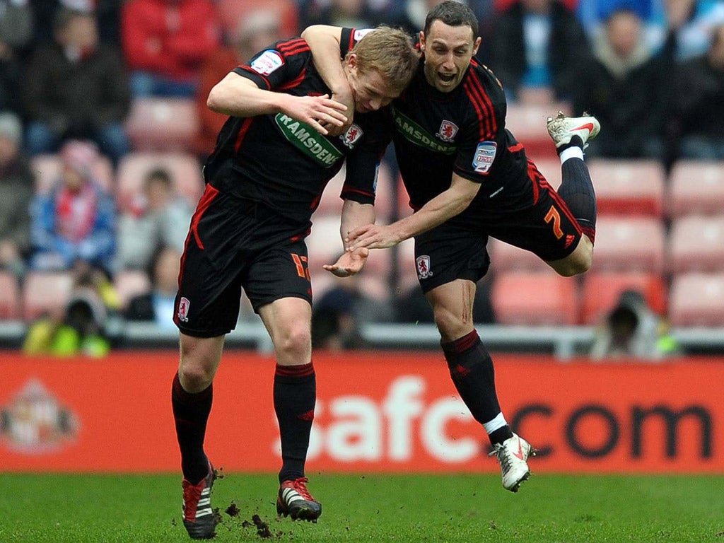 Barry Robson (left) is congratulated by Scott
McDonald after giving Boro the lead