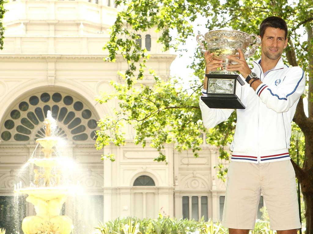 <b>Tournament end...</b><br/>
Novak Djokovic of Serbia poses with the Norman Brookes Challenge Cup after winning the 2012 men's Australian Open, at Carlton Gardens
