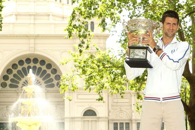 <b>Tournament end...</b><br/>
Novak Djokovic of Serbia poses with the Norman Brookes Challenge Cup after winning the 2012 men's Australian Open, at Carlton Gardens