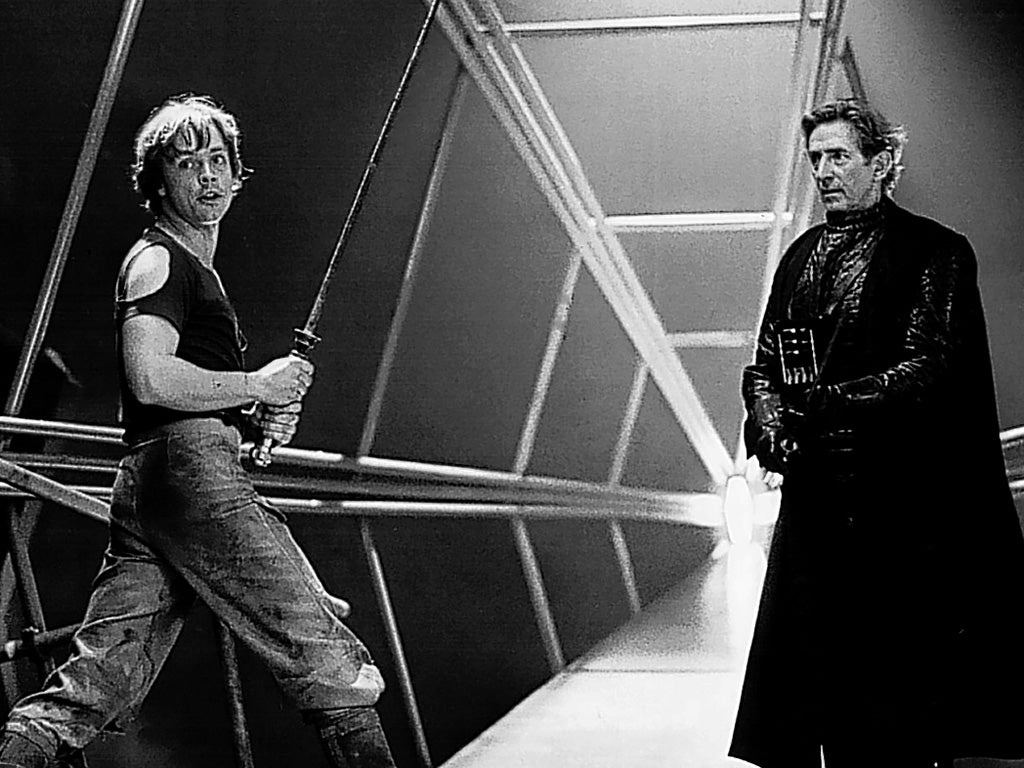 Anderson, right, rehearses a fight scene with Mark Hamill as Luke Skywalker on the set of 'Star Wars'