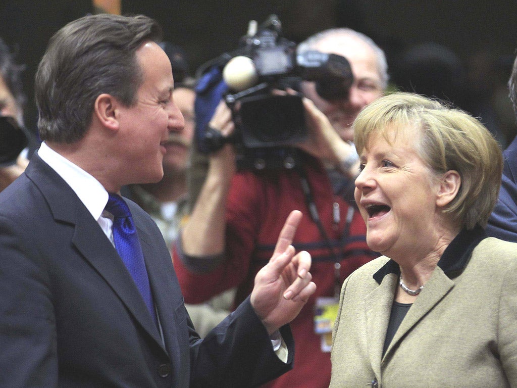 David Cameron with the German Chancellor Angela
Merkel in Brussels yesterday