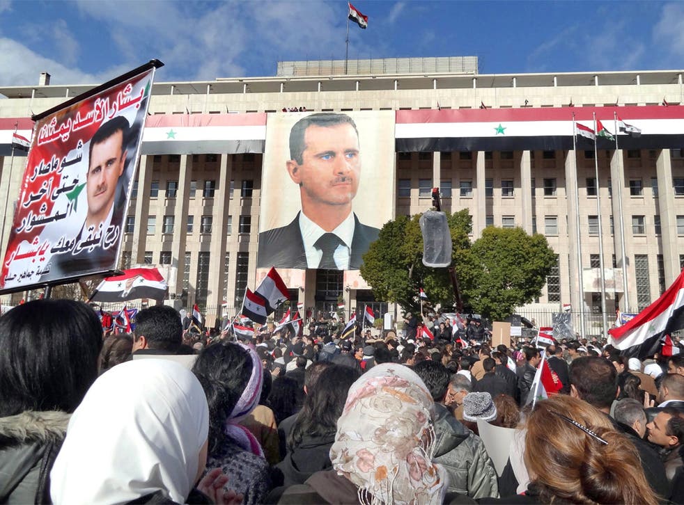 Supporters of President Bashar Assad at a rally in Sabe Bahrat square, Damascus