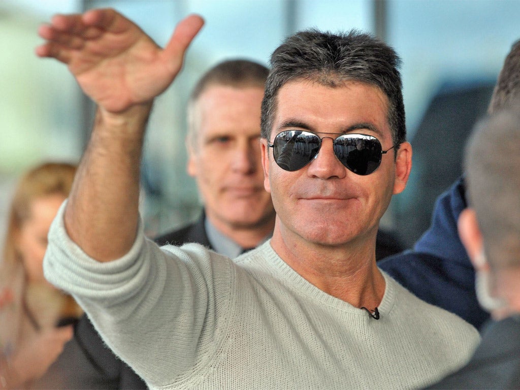 Simon Cowell was not among the packed public and press gallery in court today