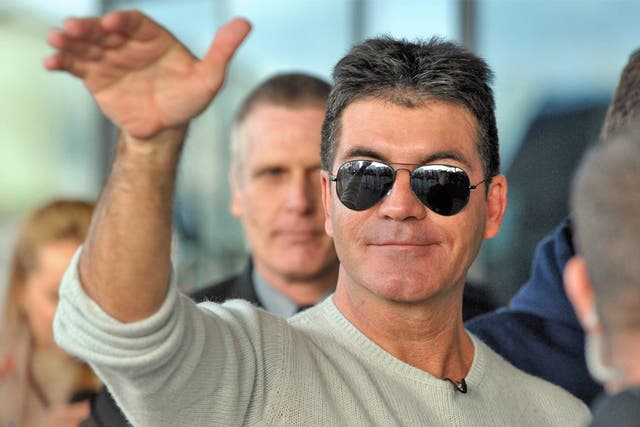 Simon Cowell was not among the packed public and press gallery in court today