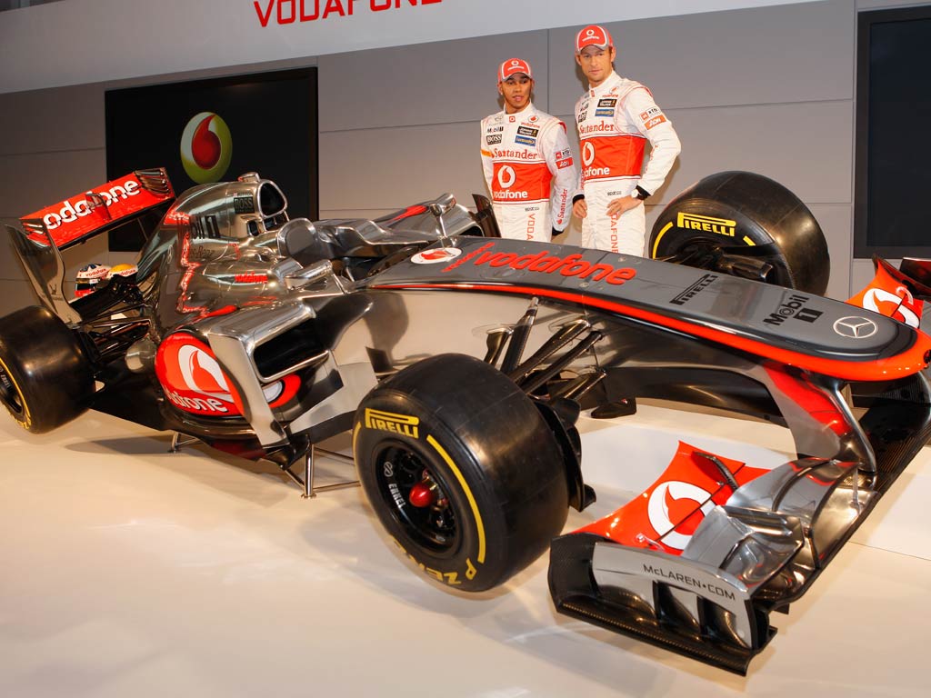Button and Hamilton pose with the new McLaren