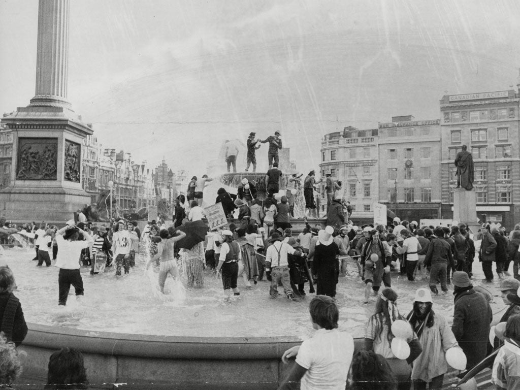 City University students attempt to set a world record for the number of people who could splash down into the Trafalgar Square fountains during their Rag Week