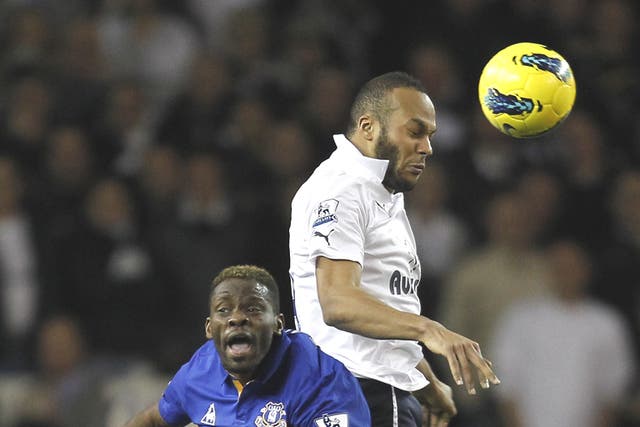 Younes Kaboul beats Louis Saha to a header in the league game last month – now they are team-mates