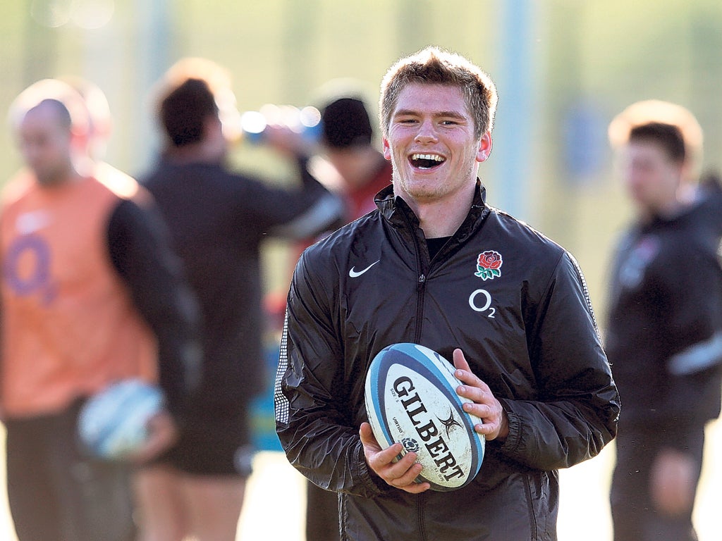 England centre Owen Farrell is all smiles at the England training session in Guildford yesterday