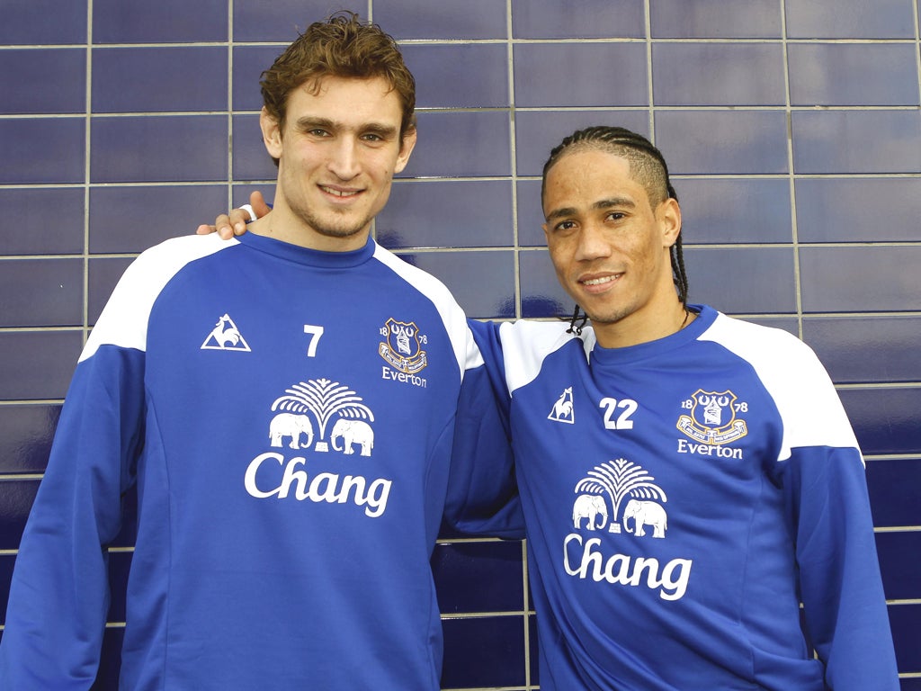 Deadline-day purchase Nikica Jelavic (left) and returning loan-signing Steven Pienaar show off their brand-new Everton shirts yesterday