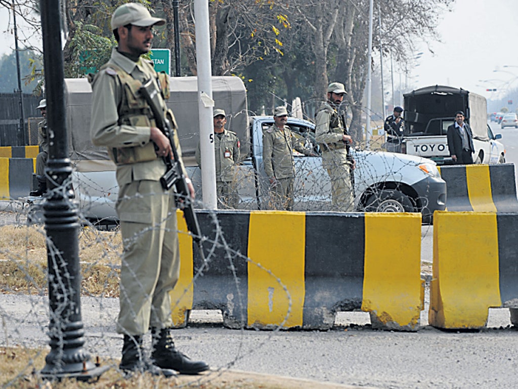 Soldiers guard the Supreme Court building in Islamabad yesterday