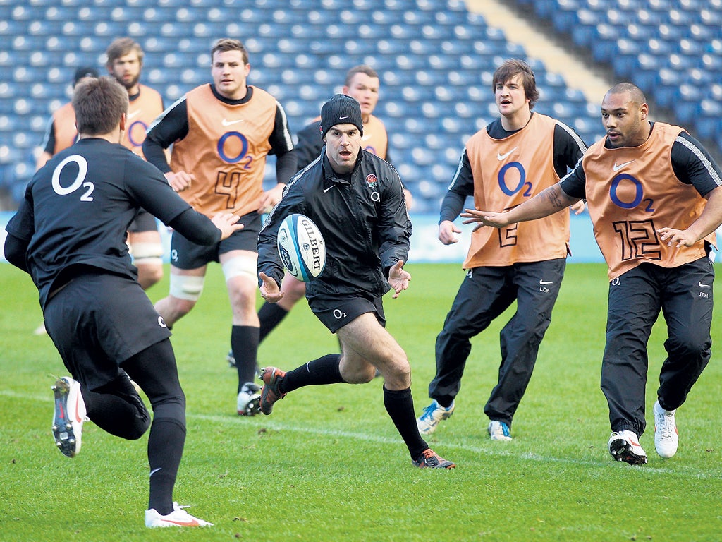 Charlie Hodgson passes as England train at Murrayfield yesterday
