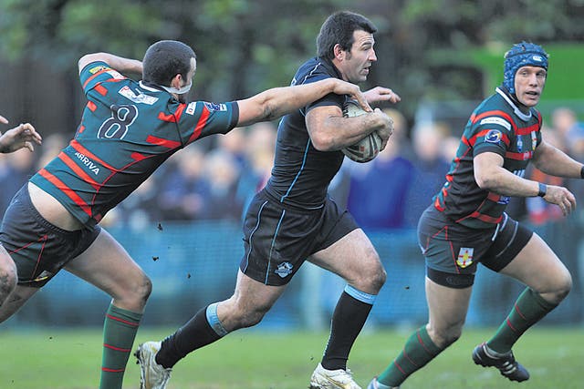 Craig Gower (centre), of London Broncos, in action during the friendly with London Skolars last week