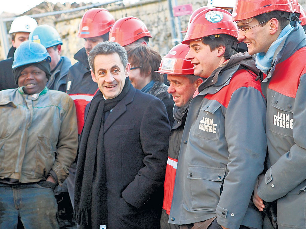 Sarkozy with the mystery ‘workforce’ that was swiftly summoned to a building site on Thursday