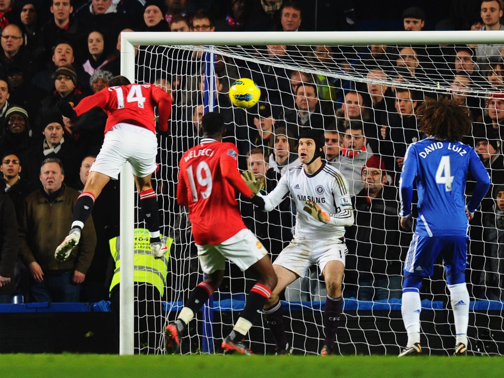 Goalkeeper Petr Cech of Chelsea fails to stop Javier Hernandez