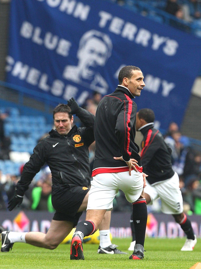 The shadow of John Terry looms over Manchester United defender Rio Ferdinand prior to kick-off yesterday