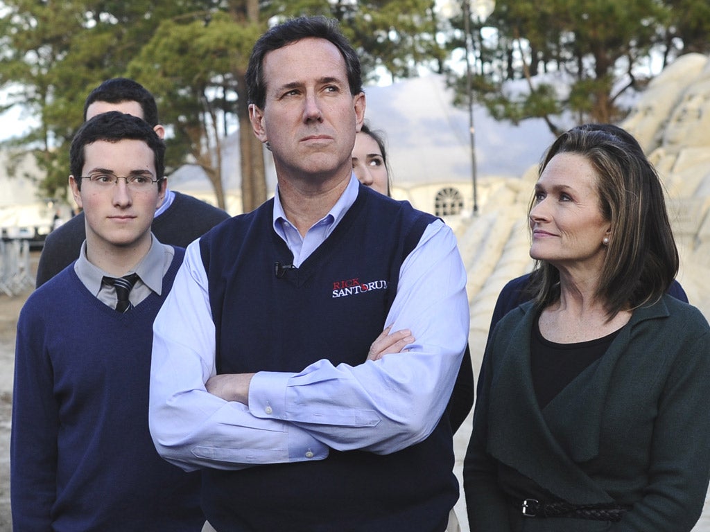 Rick Santorum campaigns with his family. He must convince voters it is he, not Newt Gingrich, who is the conservative alternative to Mitt Romney