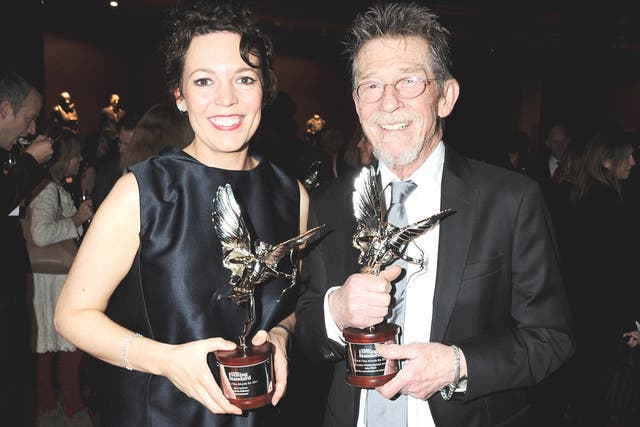 Award-winners Olivia Colman and John Hurt at the London Evening Standard British Film Awards last night