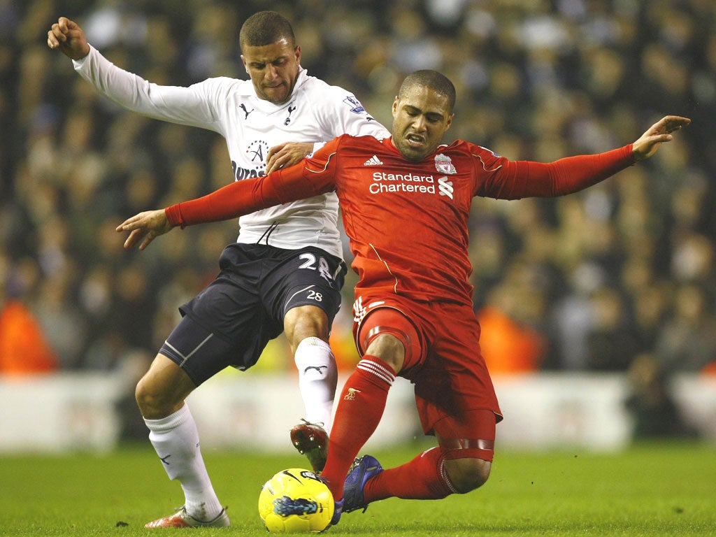 Liverpool’s Glen Johnson battles for possession with Kyle Walker at Anfield