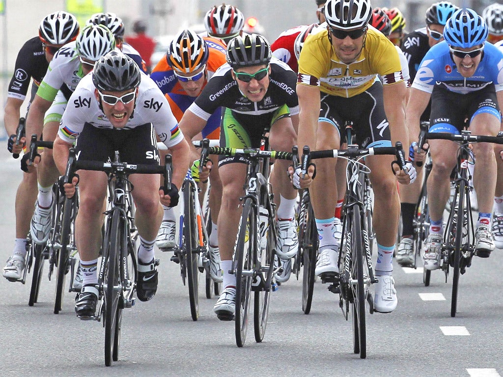 Mark Cavendish (left), of Team Sky, sprints ahead of Tom Boonen to win the third stage of the Tour of Qatar yesterday