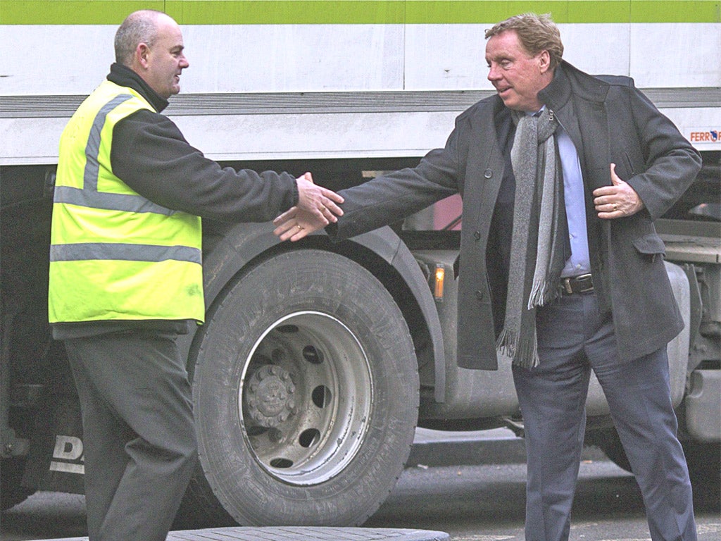 Harry Redknapp shakes hands with a well-wisher as he arrives at Southwark Crown Court yesterday
