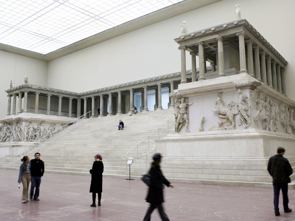Visitors admire the front entrance to the altar from the ancient Greek city of Pergamon at the Pergamon Museum