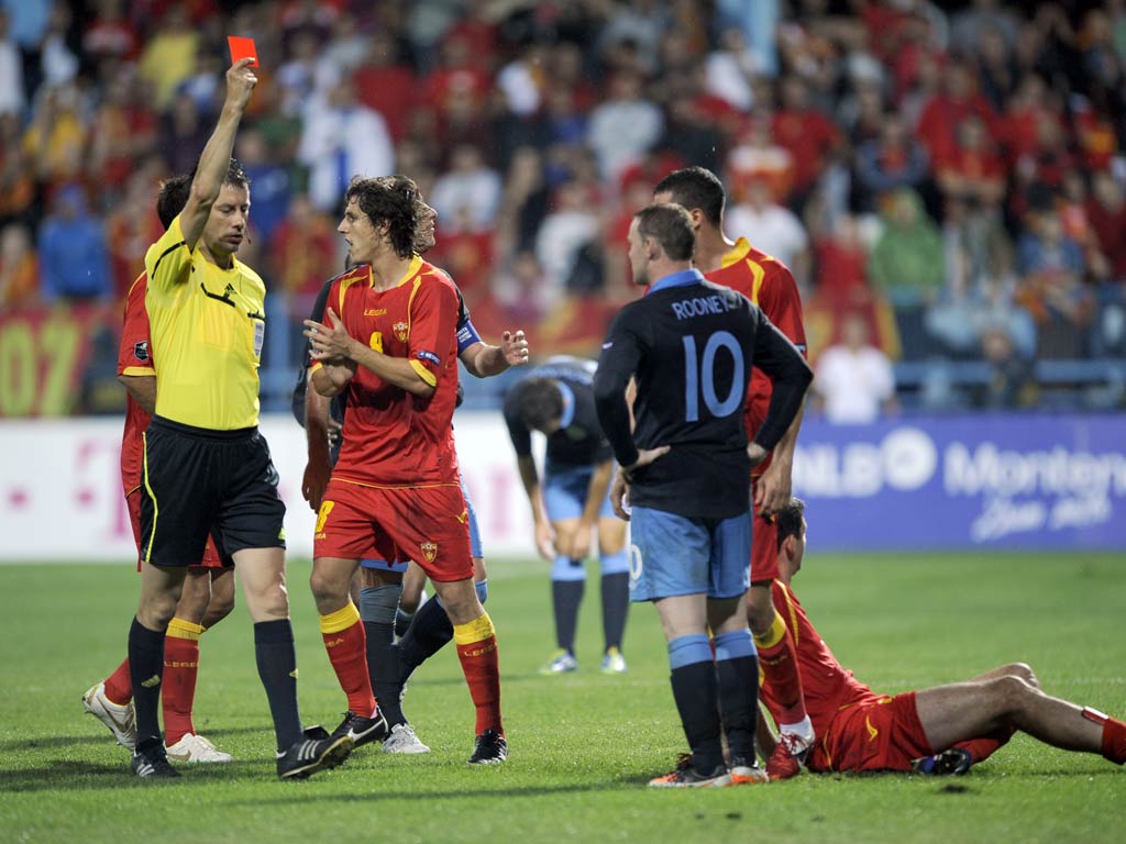 October 2011 - Despite remaining unbeaten in qualifying, England survive spirited second-half fightback by Montenegro in Podgorica to book their finals place. However, Rooney is sent off and subsequently banned for three games.