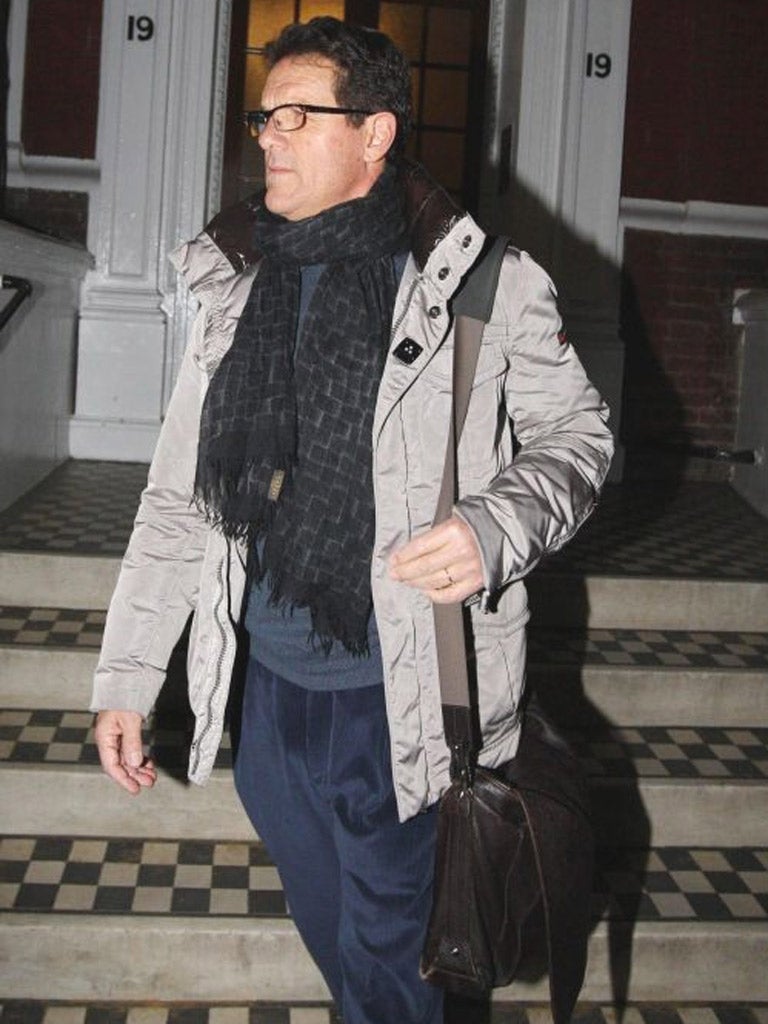 Fabio Capello leaves his home in central London yesterday
