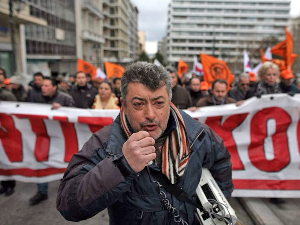 Employees of the Public Power Corporation protest over plans for privatisation in Athens yesterday