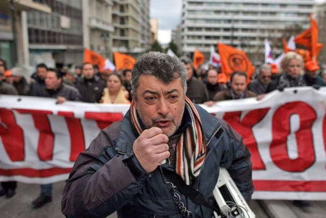 Employees of the Public Power Corporation protest over plans for privatisation in Athens yesterday