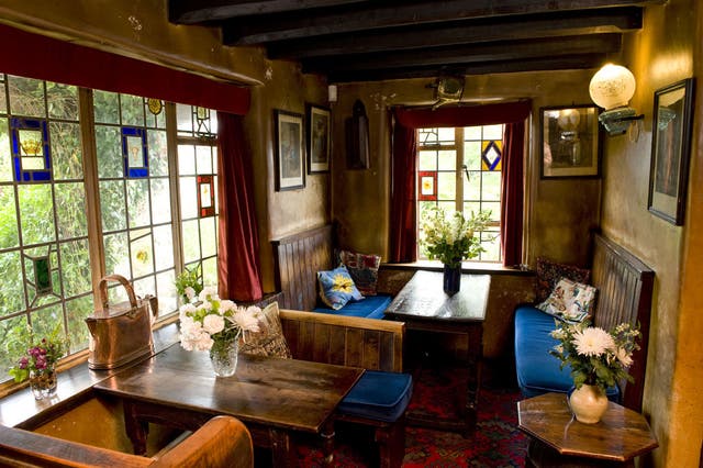 The Nobody Inn has a beautiful thatched roof, low black roof beams, a blazing fireplace and rickety, beer-stained tables