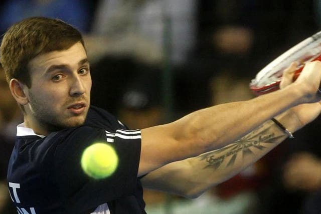 Dan Evans (pictured) on his way to victory over Slovakia's Lukas Lacko yesterday