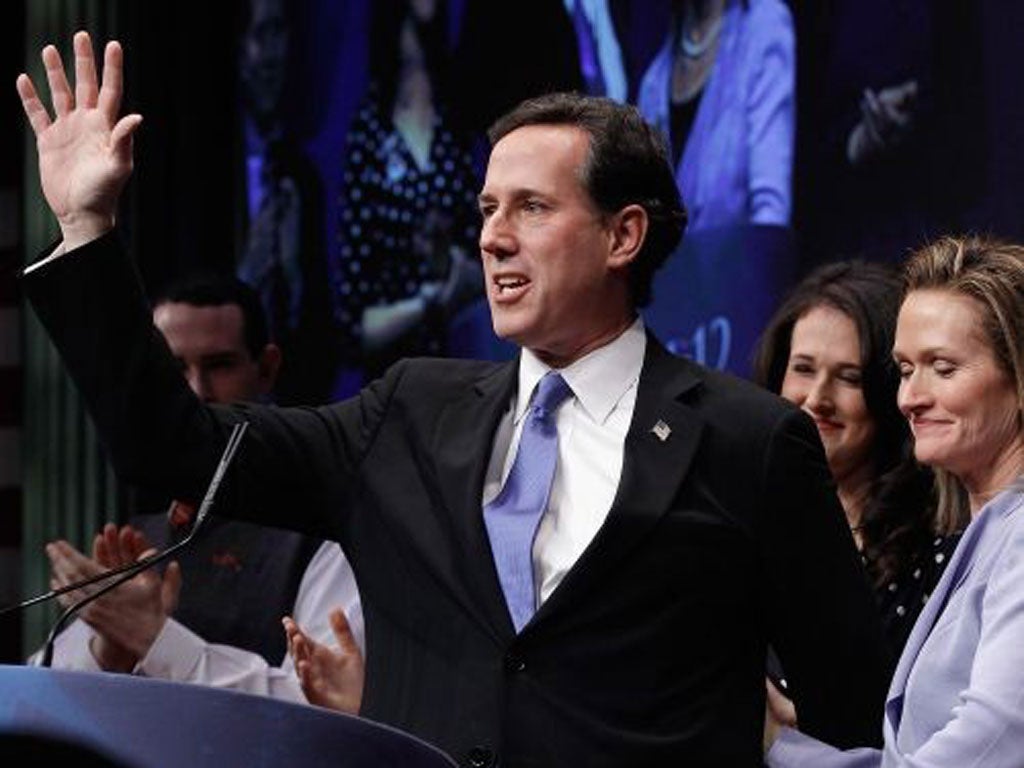 Rick Santorum is joined on stage by his wife Karen, right, and family at a Conservative Political Action Conference in Washington yesterday