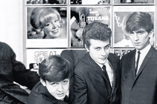 Decca’s Dick Rowe, left, turned down the Beatles