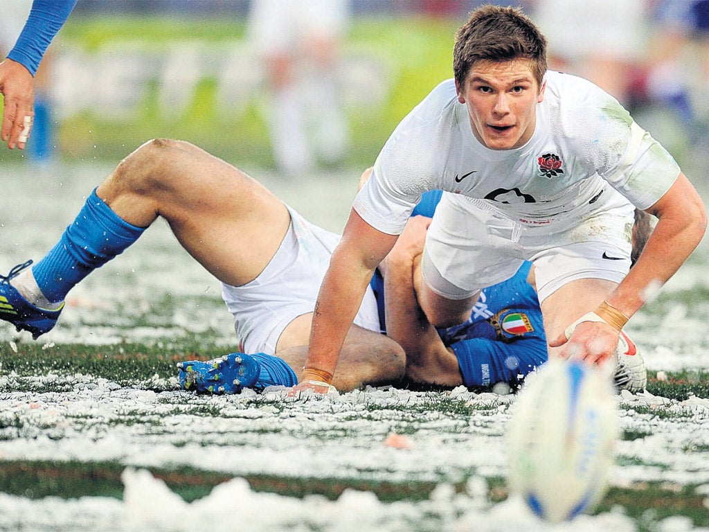 Owen Farrell keeps his eye on the ball at a snow-covered Stadio Olimpico