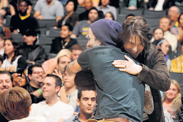 David Beckham and Tom Cruise feel the love. But is it
only shared fame that binds them?