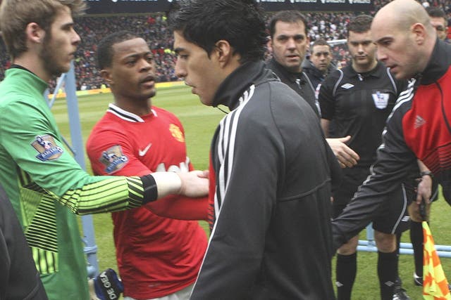 Handbags, no handshakes: Suarez refuses to shake Evra’s hand
