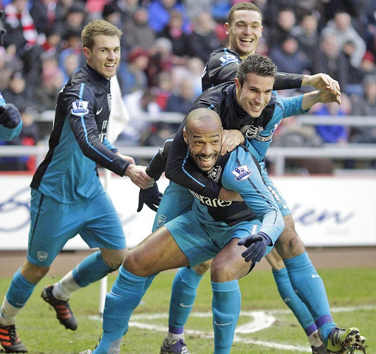 Thierry Henry celebrates after scoring the last-gasp winner