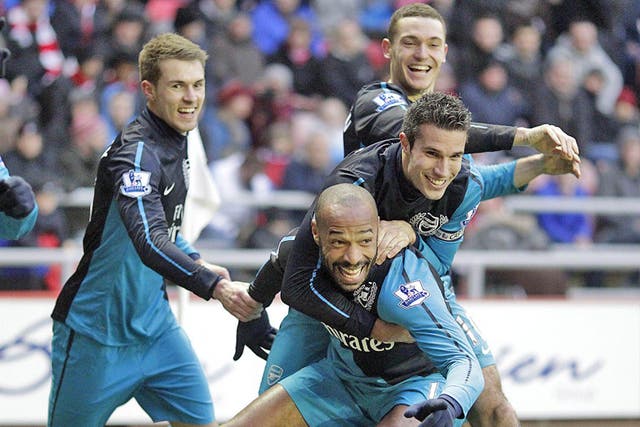 Thierry Henry celebrates after scoring the last-gasp winner