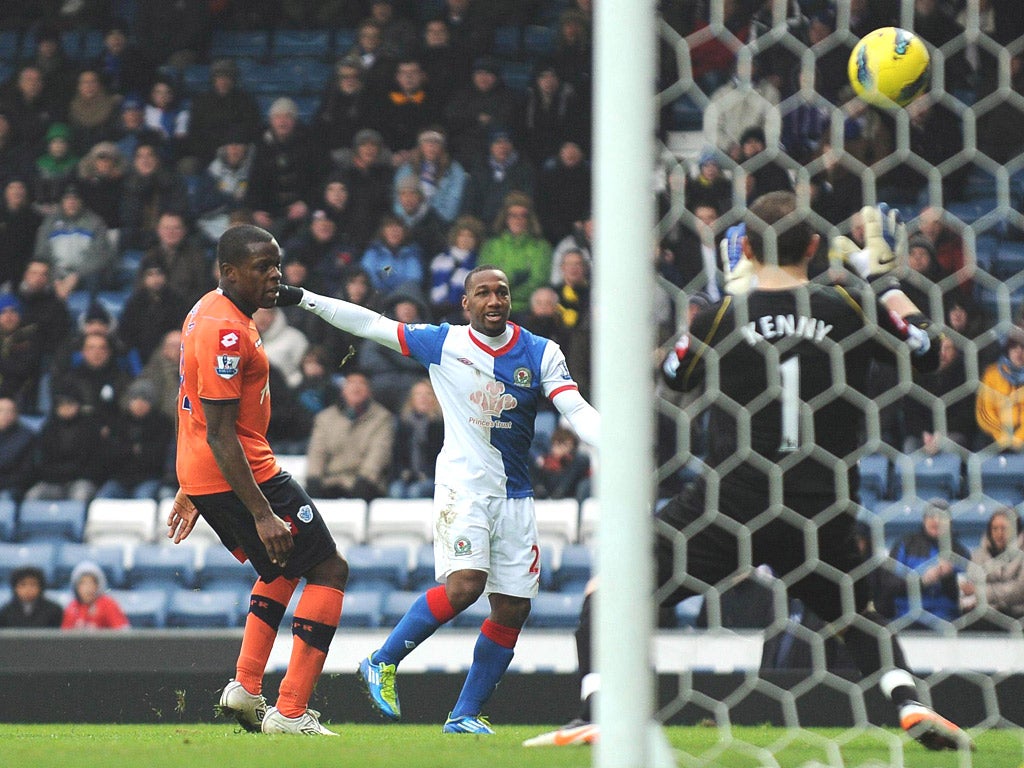 Rover and rout: Junior Hoilett fires his side’s third past QPR keeper Paddy Kenny